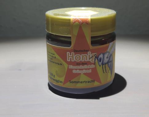 250g Glas Sommertrachthonig mit Etikett des Bienenkollektivs Grüngürtel
